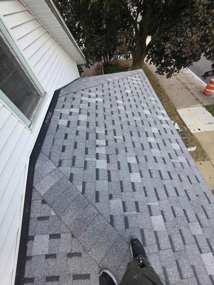 A freshly installed shingle roof on a Racine-area home